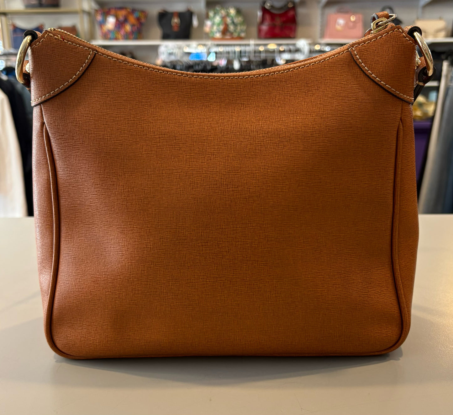 Dooney & Bourke Saffiano Leather Kimberly Crossbody in the Color Natural