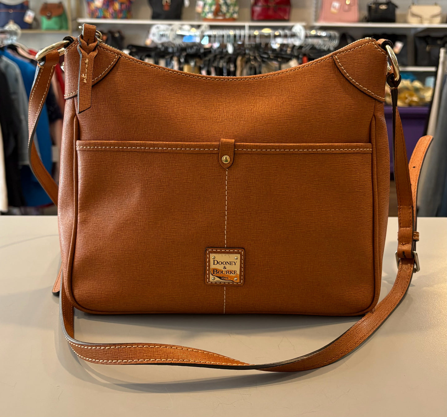 Dooney & Bourke Saffiano Leather Kimberly Crossbody in the Color Natural
