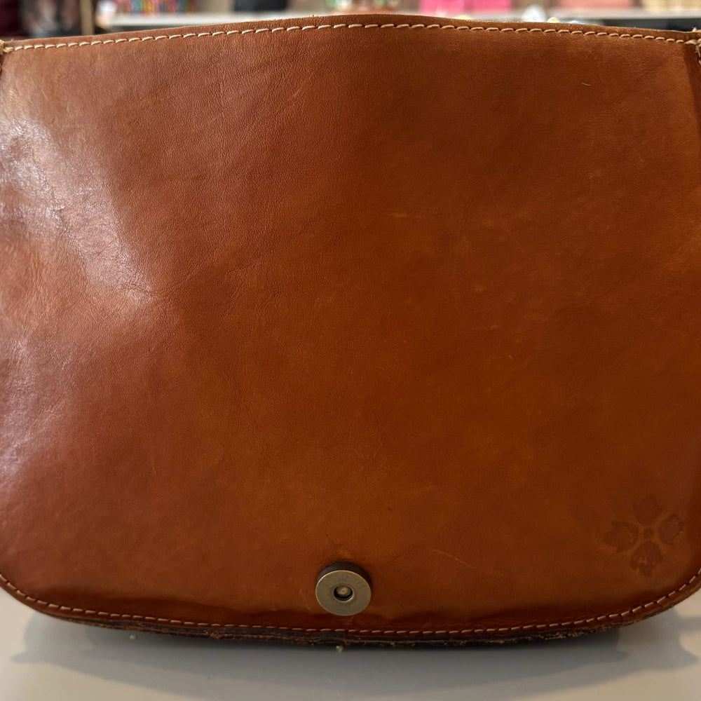 
                      
                        Patricia Nash Metauro Tooled Leather Saddle Bag
                      
                    