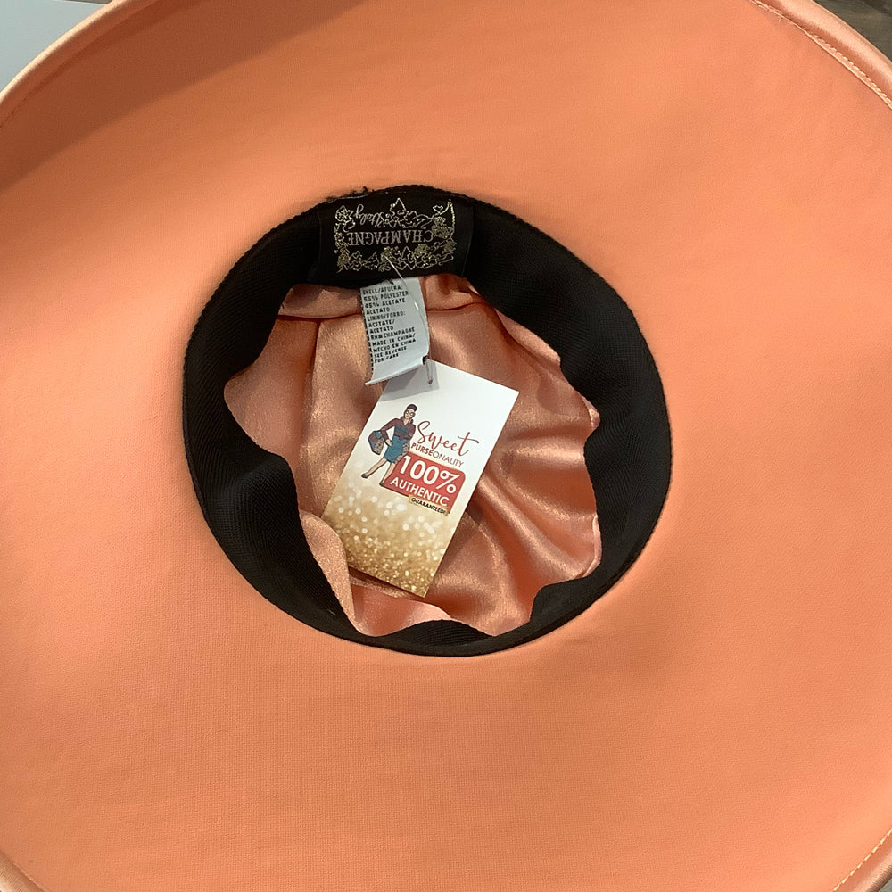 
                      
                        Champagne Italy Pastel Orange Church Hat with Large Bow Detailing
                      
                    